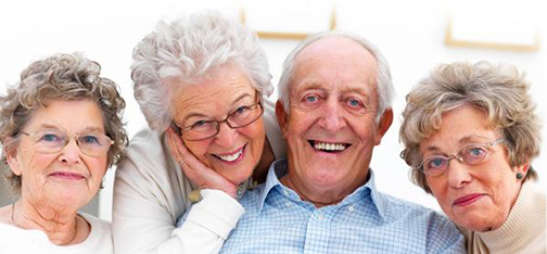 [Photo of smiling older people]
