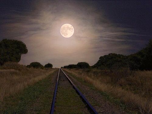 [Photo of moonlit railroad tracks]