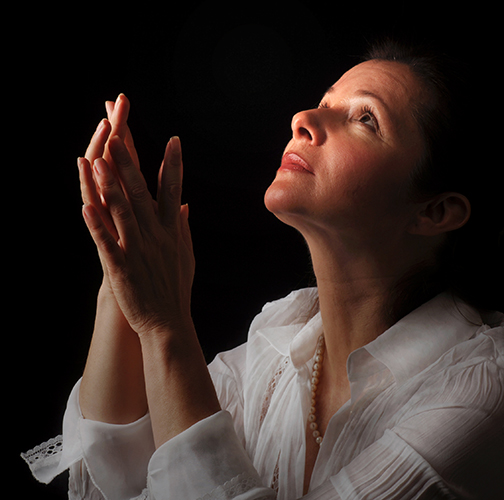 [Photo of a woman praying]
