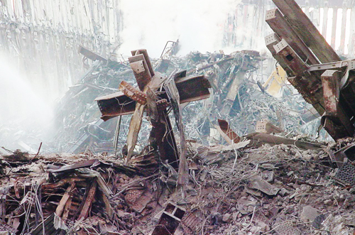 [Photo of a cross in the rubble of the World Trade Center]