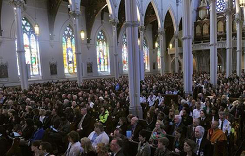 [Photo of people inside a church]