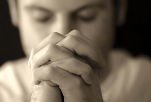Photo of a man praying