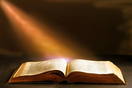 Photo of a sunbeam on an open bible