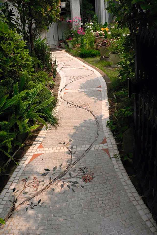 [Photo of a path with a vine superimposed]